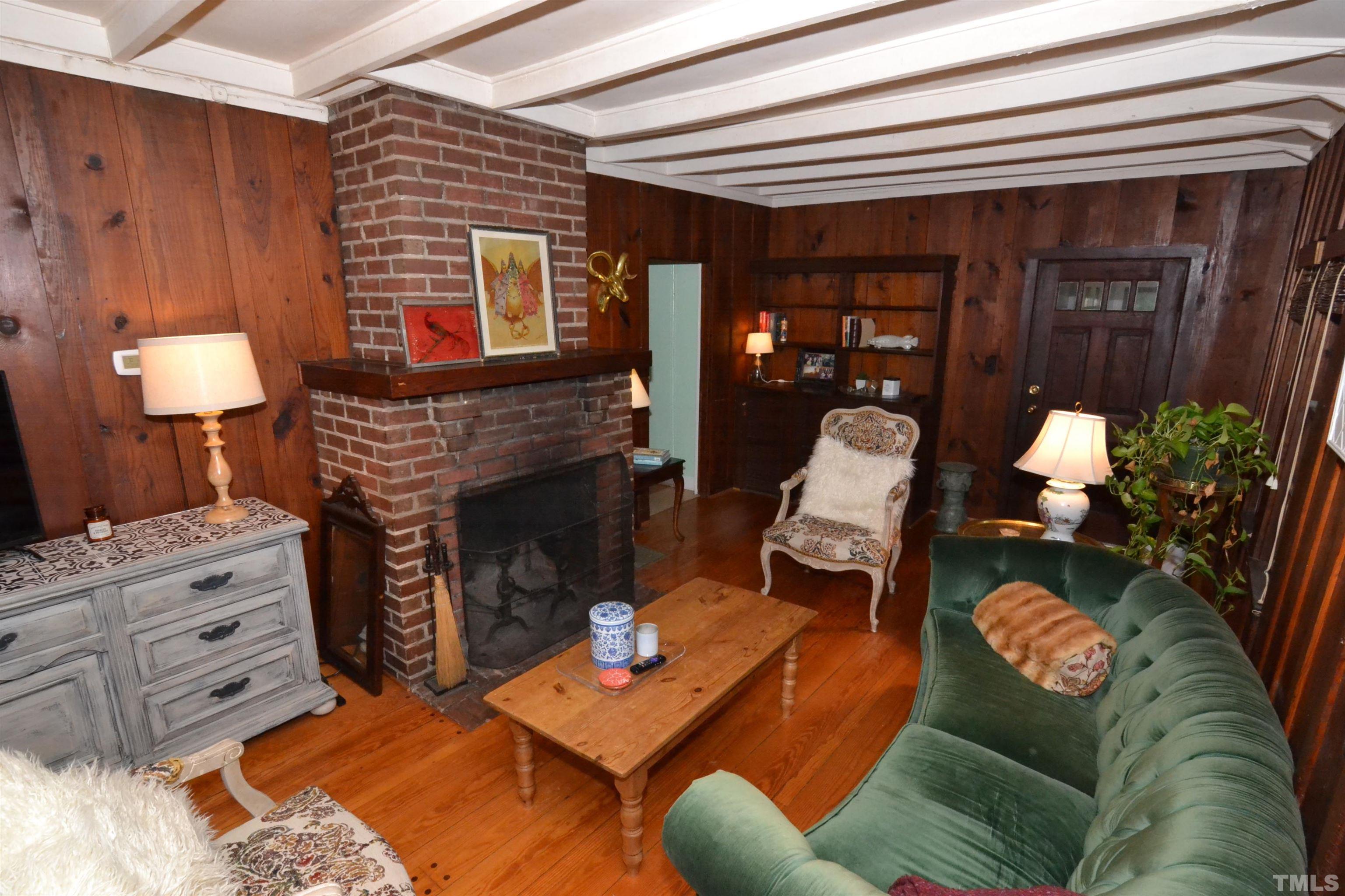 1004 Brooks Avenue Raleigh, NC 27607 - Photo 7 of 17 a living room with furniture and a fireplace
