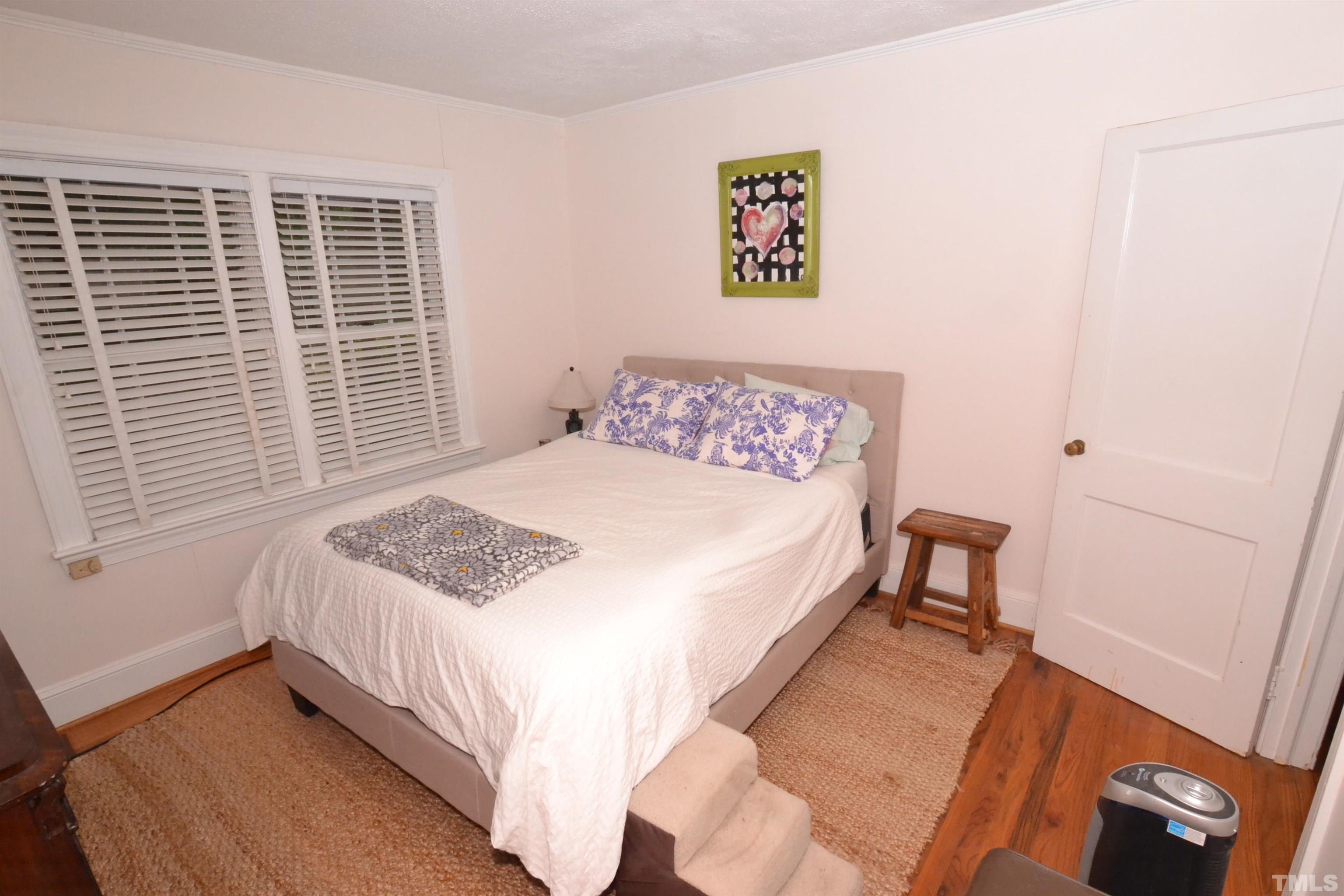 1004 Brooks Avenue Raleigh, NC 27607 - Photo 9 of 17 a bedroom with a bed and a window