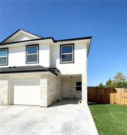 a front view of a house with a garage