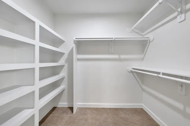 a view of an empty walk in closet