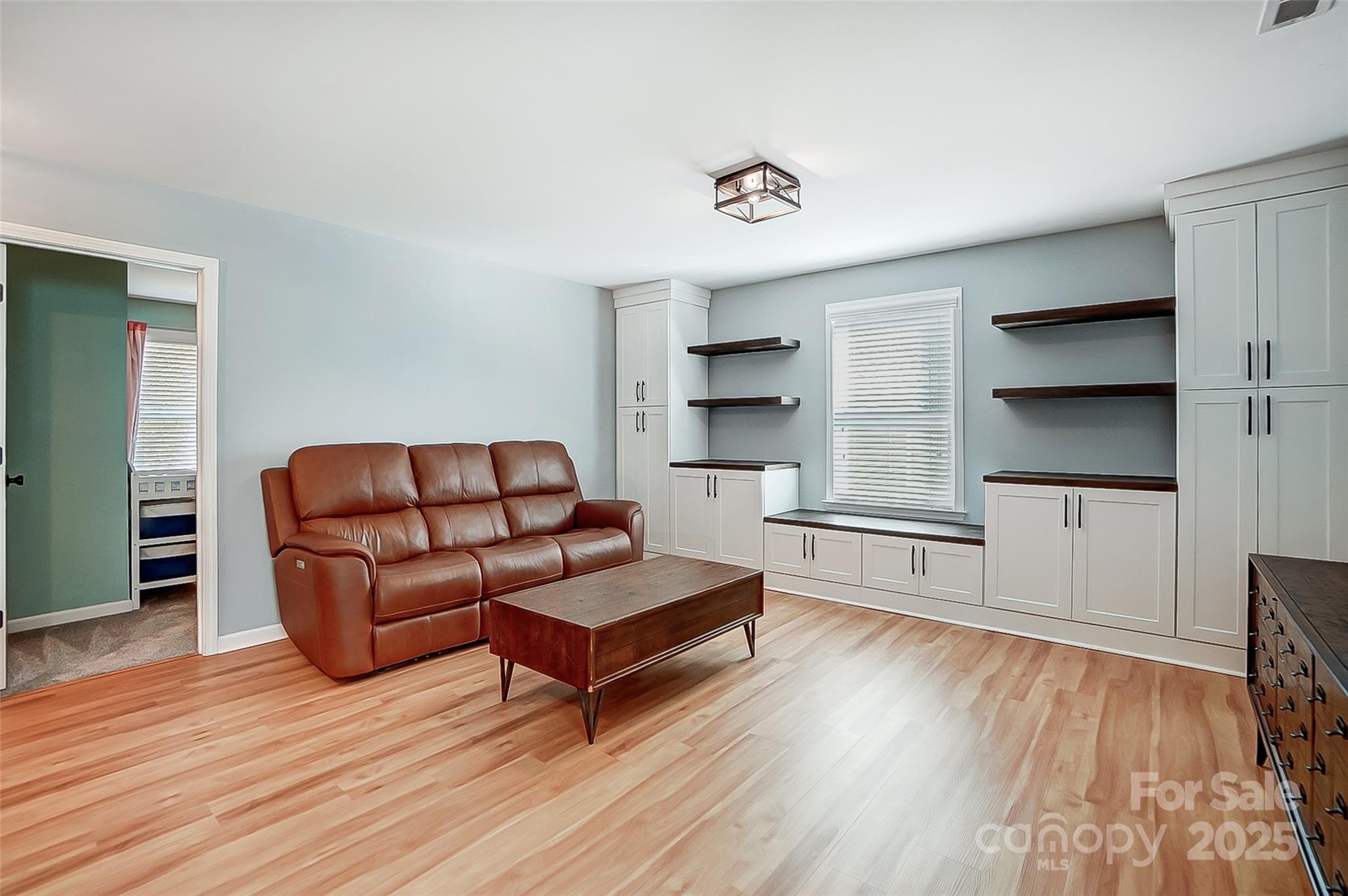 2222 Bluebell Way Fort Mill, SC 29708 - Photo 20 of 41 a living room with furniture and a wooden floor