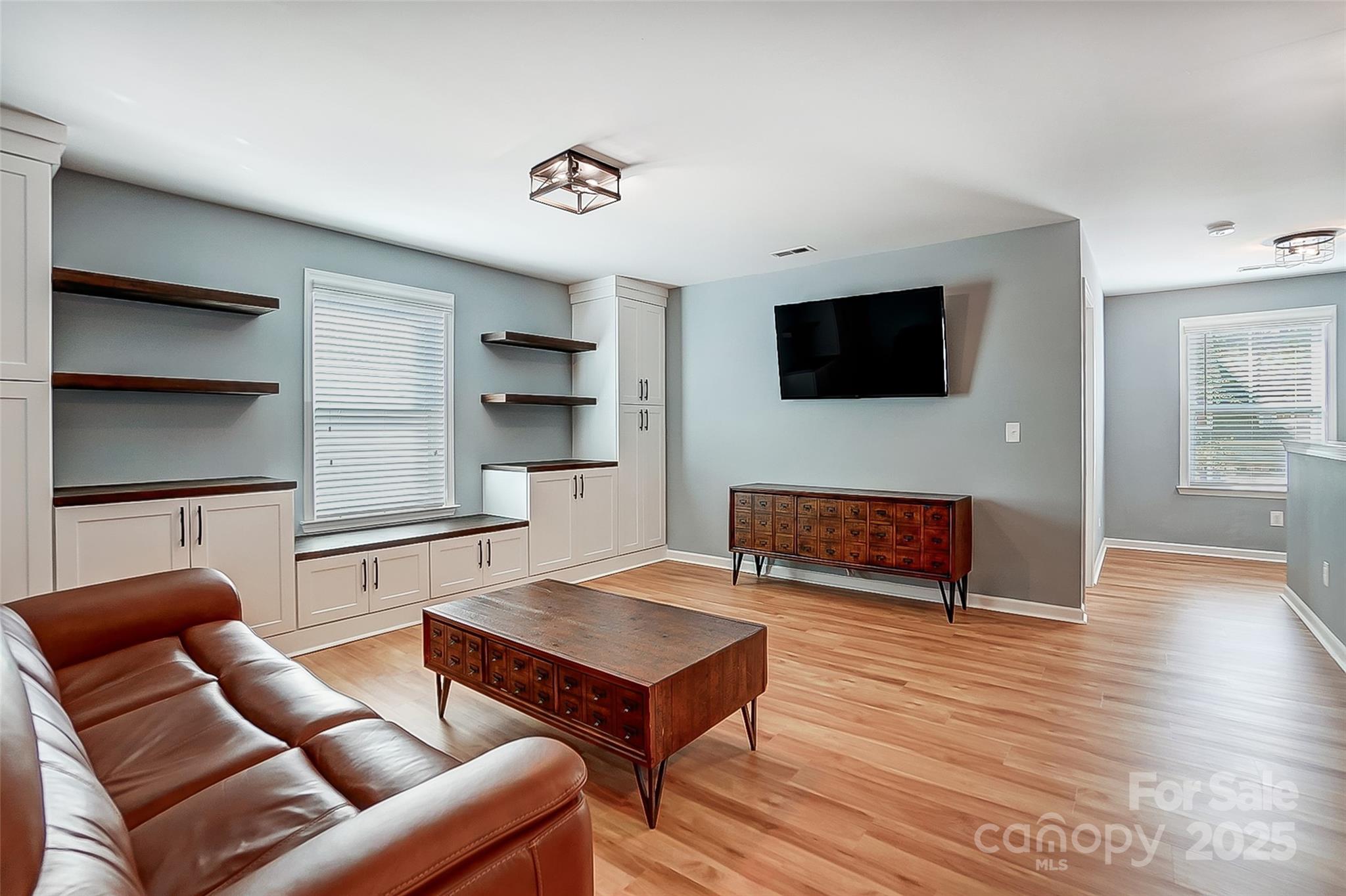 2222 Bluebell Way Fort Mill, SC 29708 - Photo 21 of 41 a living room with furniture and a flat screen tv