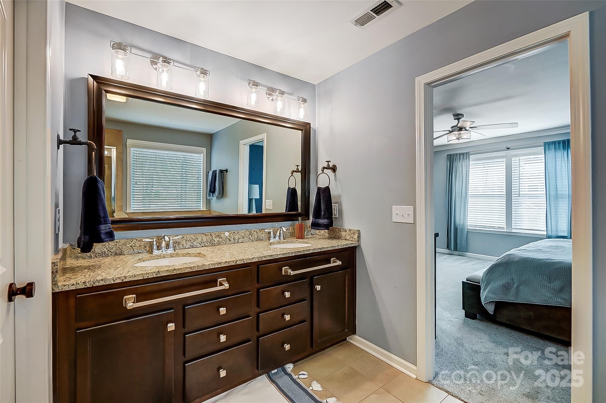 2222 Bluebell Way Fort Mill, SC 29708 - Photo 25 of 41 a en suite bathroom with a granite countertop sink and a mirror