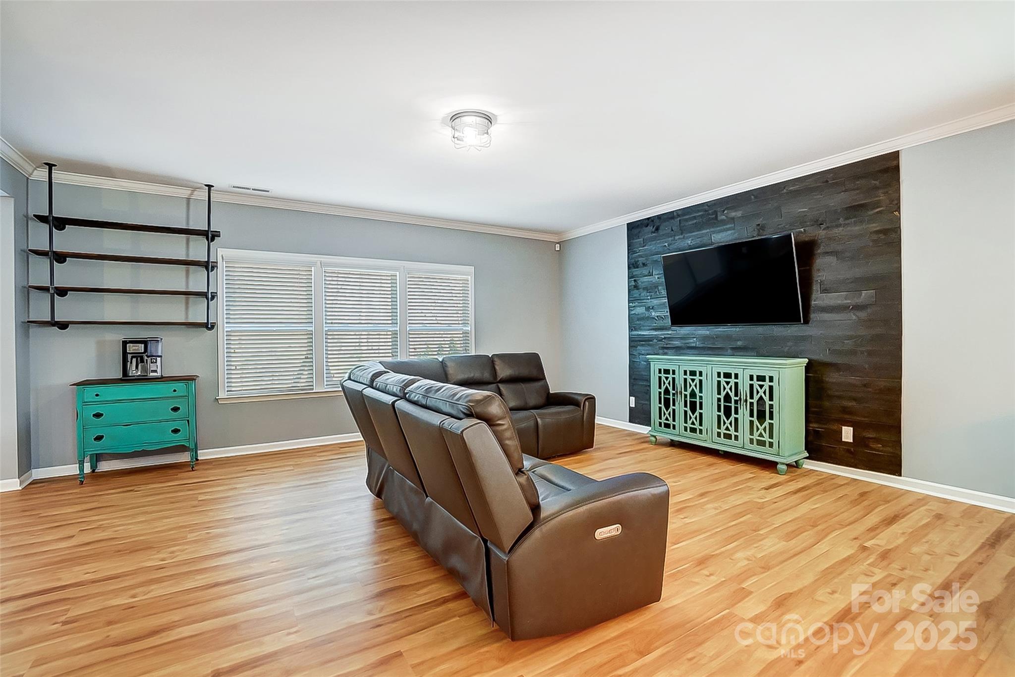 2222 Bluebell Way Fort Mill, SC 29708 - Photo 4 of 41 a living room with furniture and a flat screen tv
