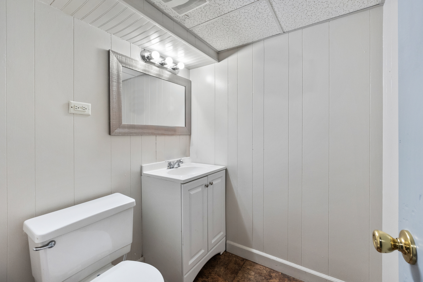 18275 Ada Street Lansing, IL 60438 - Photo 15 of 18 a bathroom with a toilet sink and mirror
