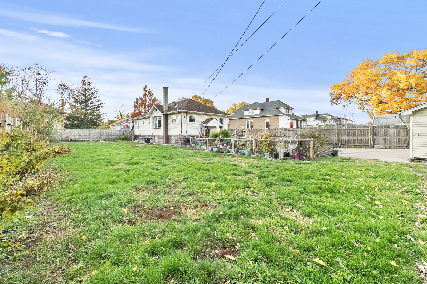 18275 Ada Street Lansing, IL 60438 - Photo 2 of 18 a view of a house with a big yard and large trees