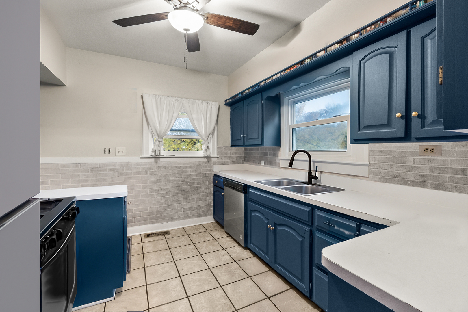 18275 Ada Street Lansing, IL 60438 - Photo 8 of 18 a kitchen with a sink appliances and cabinets