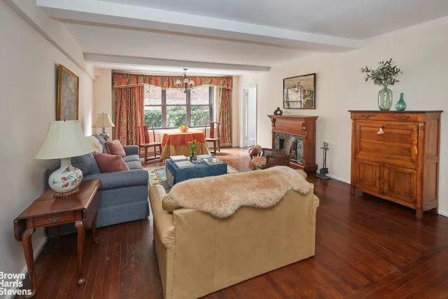 a bedroom with a bed and glass window