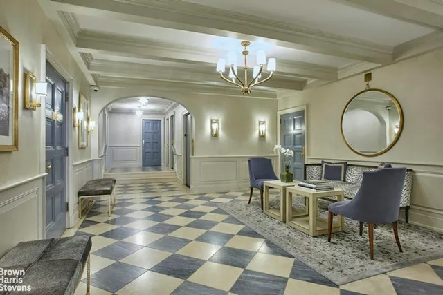 a living room with furniture a fireplace and a wooden floor