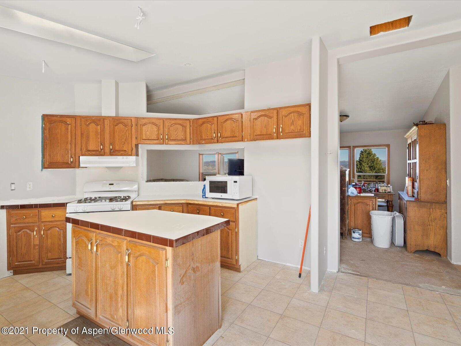 4300 Grass Mesa Road Rifle, CO 81650 - Photo 13 of 45 a utility room with washer and dryer