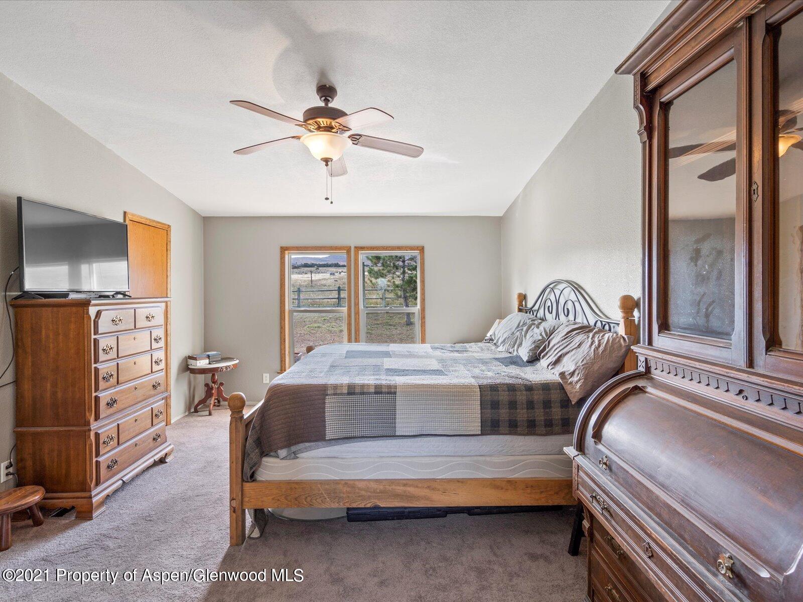 4300 Grass Mesa Road Rifle, CO 81650 - Photo 22 of 45 a bedroom with furniture and a window