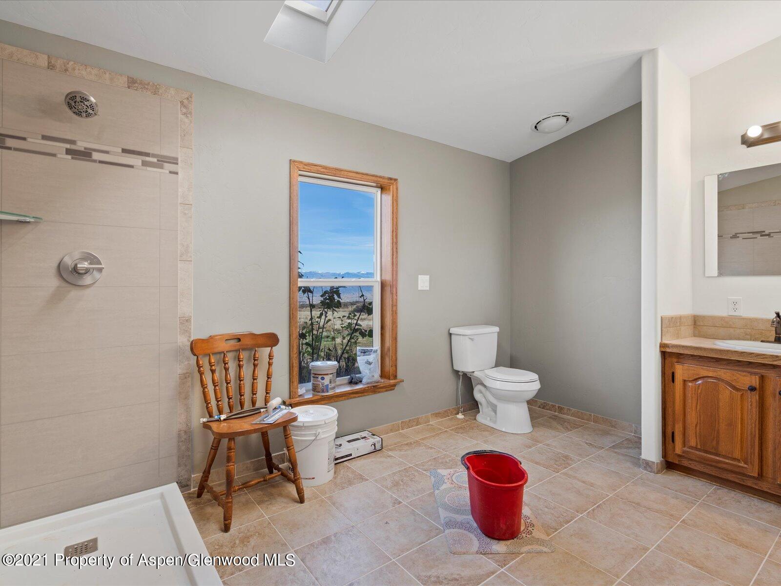 4300 Grass Mesa Road Rifle, CO 81650 - Photo 23 of 45 a living room with furniture a rug and a toilet