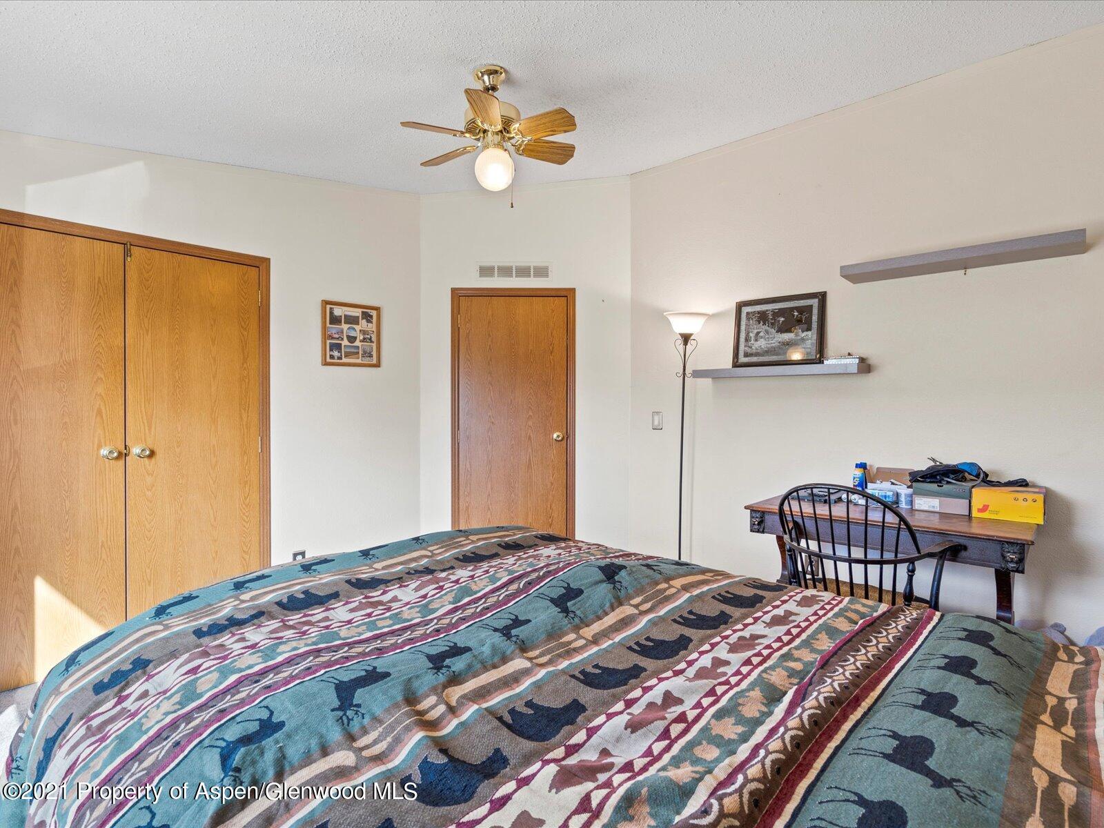 4300 Grass Mesa Road Rifle, CO 81650 - Photo 28 of 45 a bedroom with bed and window