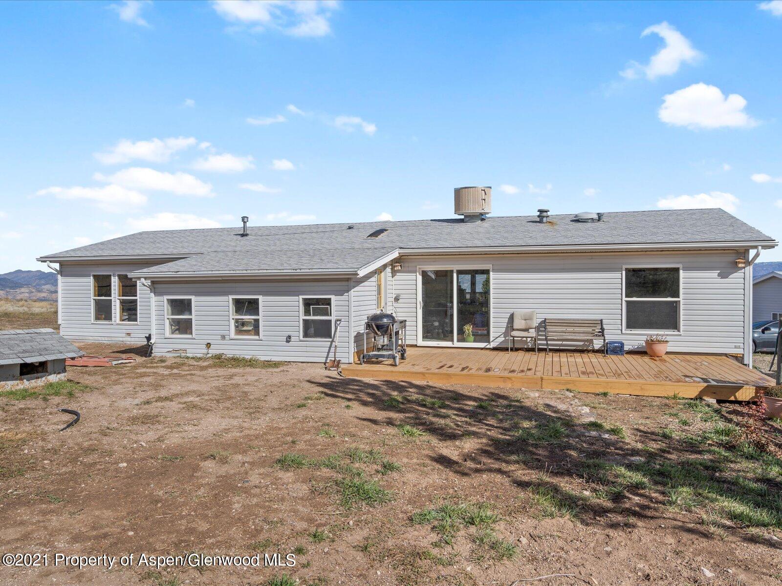 4300 Grass Mesa Road Rifle, CO 81650 - Photo 3 of 45 a front view of a house with a garden