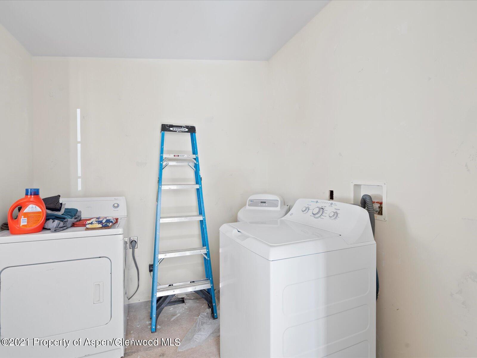4300 Grass Mesa Road Rifle, CO 81650 - Photo 32 of 45 a utility room with dryer and washer