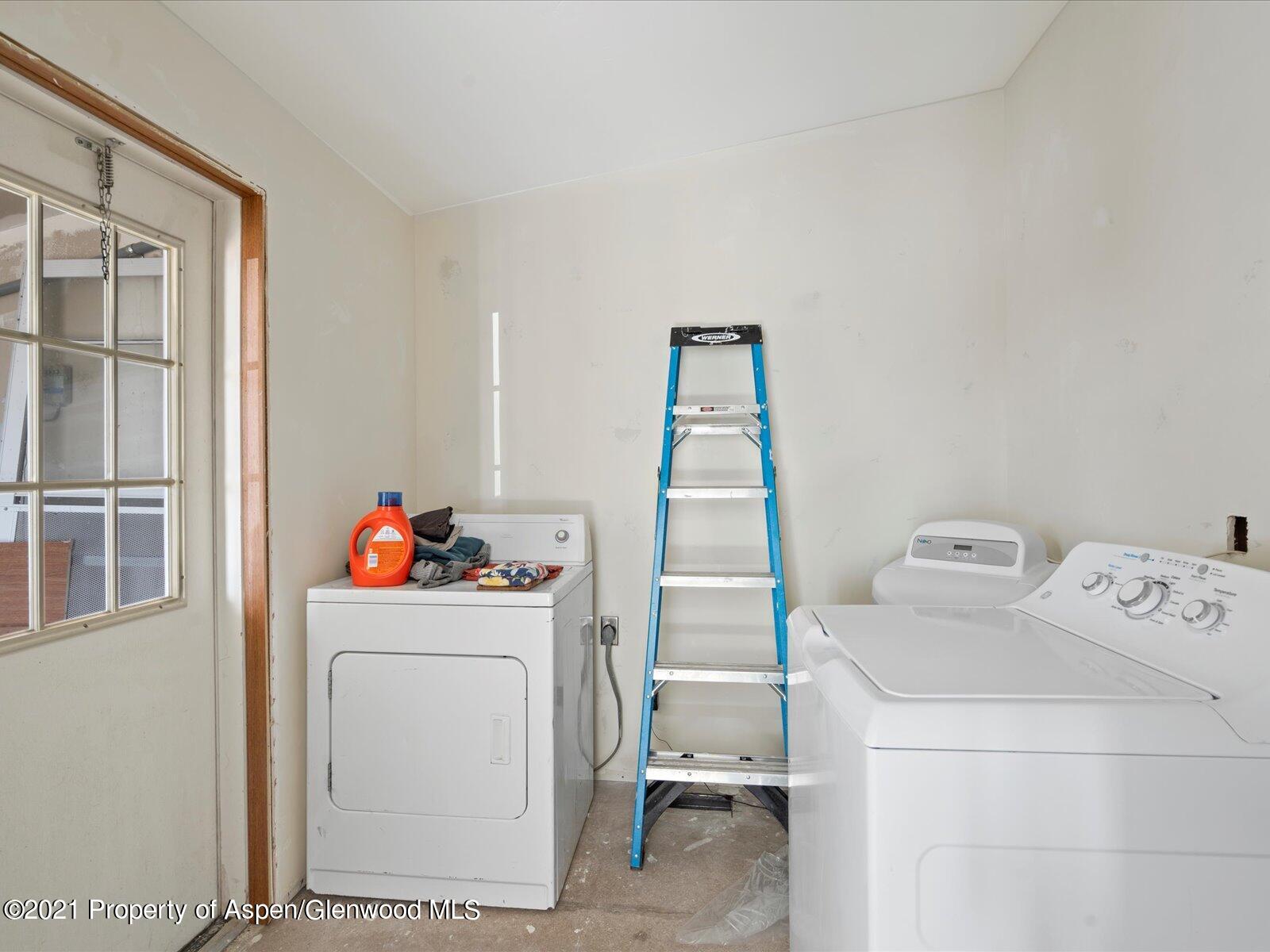 4300 Grass Mesa Road Rifle, CO 81650 - Photo 33 of 45 a utility room with dryer and washer