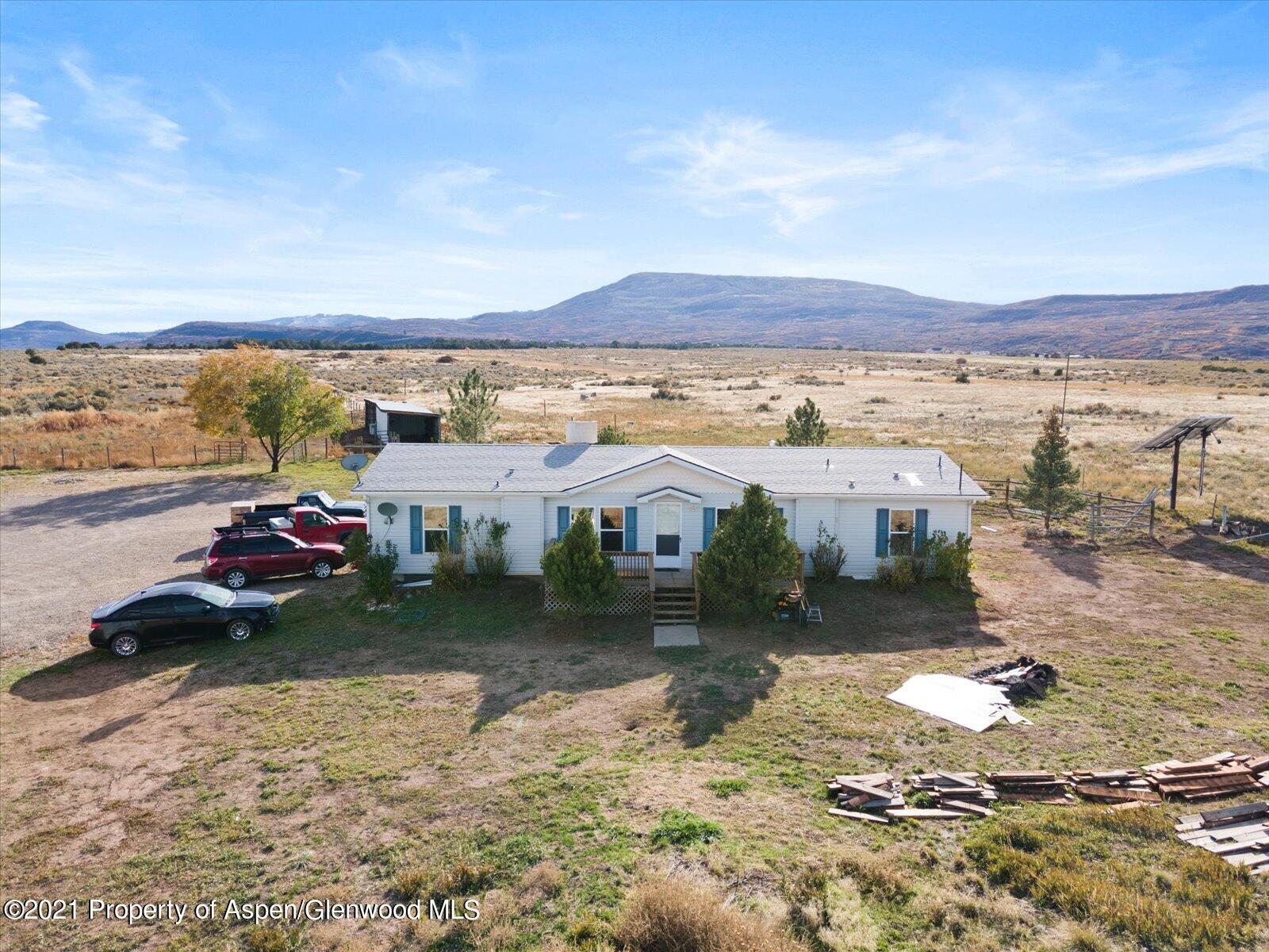 4300 Grass Mesa Road Rifle, CO 81650 - Photo 34 of 45 a view of a lake with a mountain in the background