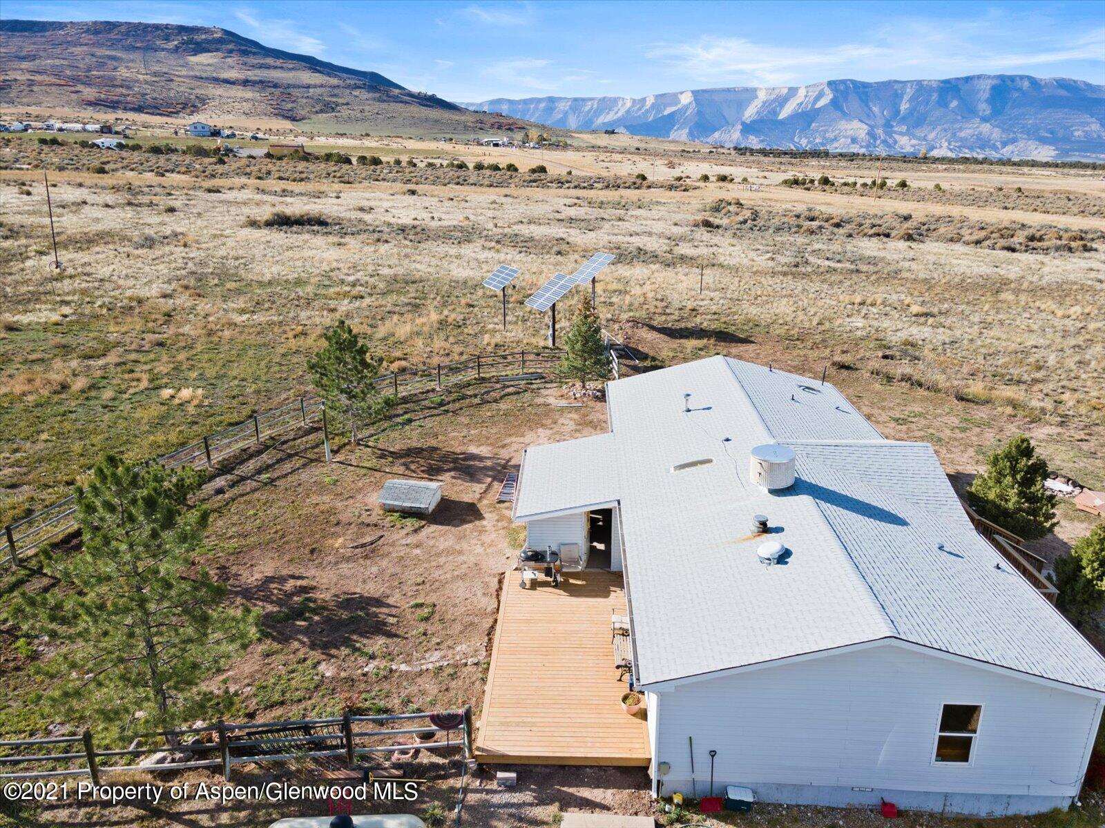 4300 Grass Mesa Road Rifle, CO 81650 - Photo 36 of 45 an aerial view of residential houses with outdoor space