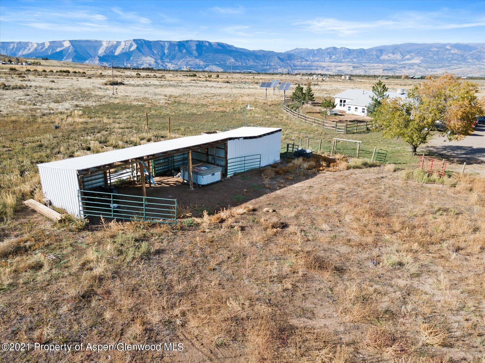 4300 Grass Mesa Road Rifle, CO 81650 - Photo 42 of 45 a view of a lake with a mountain in the background