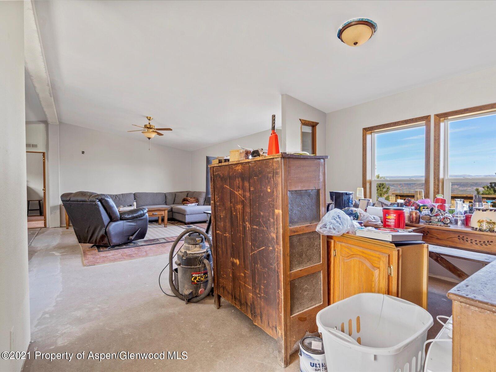 4300 Grass Mesa Road Rifle, CO 81650 - Photo 8 of 45 a bedroom with a bed and a couch