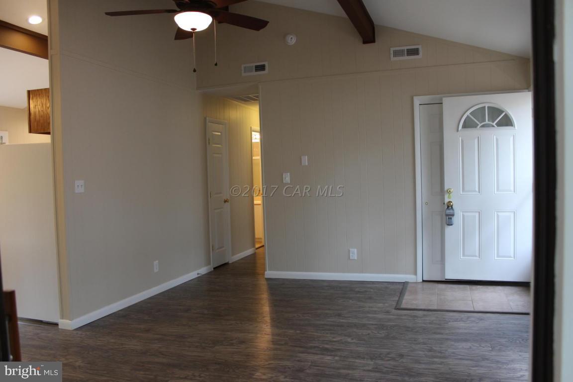 129 Windjammer Road Ocean Pines, MD 21811 - Photo 2 of 36 a view of a livingroom with wooden floor