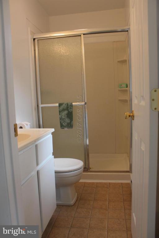 129 Windjammer Road Ocean Pines, MD 21811 - Photo 12 of 36 a bathroom with a toilet and a shower