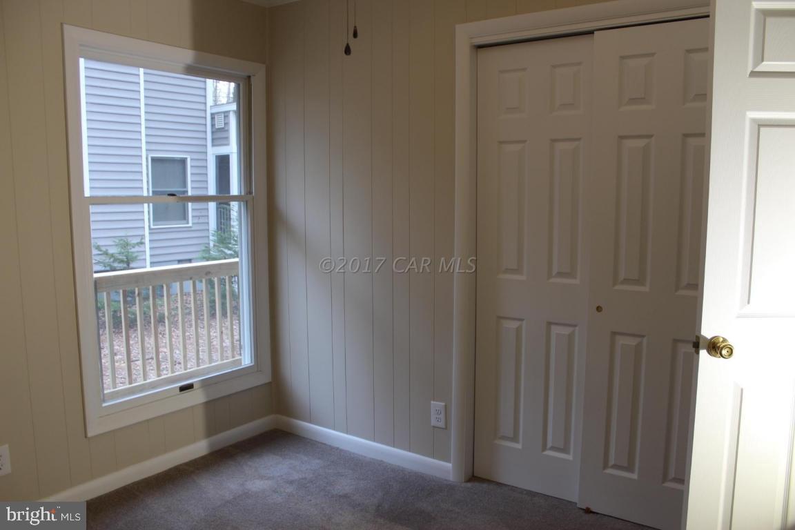129 Windjammer Road Ocean Pines, MD 21811 - Photo 14 of 36 a view of an empty room with a window