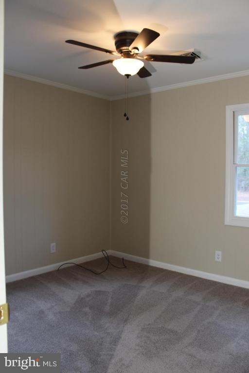 129 Windjammer Road Ocean Pines, MD 21811 - Photo 16 of 36 a view of room with a ceiling fan and window