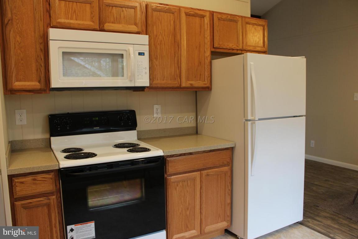 129 Windjammer Road Ocean Pines, MD 21811 - Photo 20 of 36 a refrigerator freezer sitting inside of a kitchen