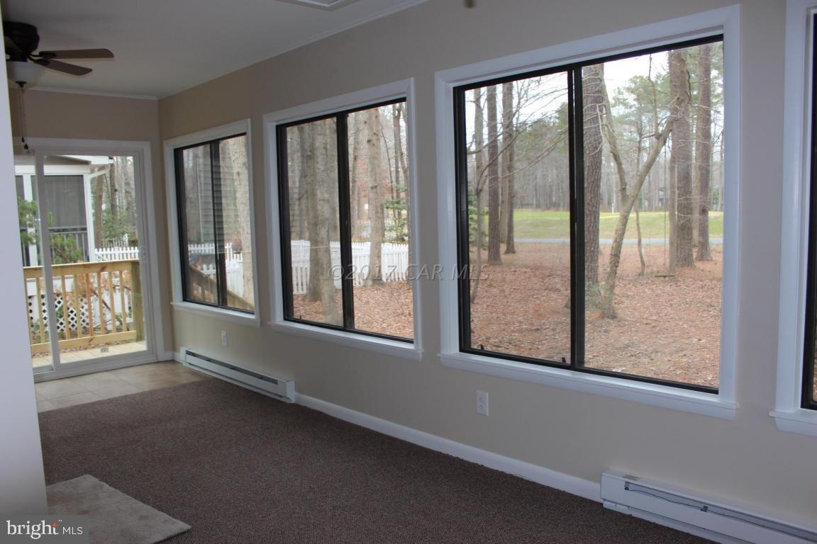 129 Windjammer Road Ocean Pines, MD 21811 - Photo 22 of 36 a view of an empty room with a window