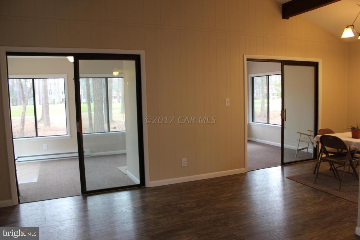 129 Windjammer Road Ocean Pines, MD 21811 - Photo 6 of 36 a view of empty room with wooden floor and fan