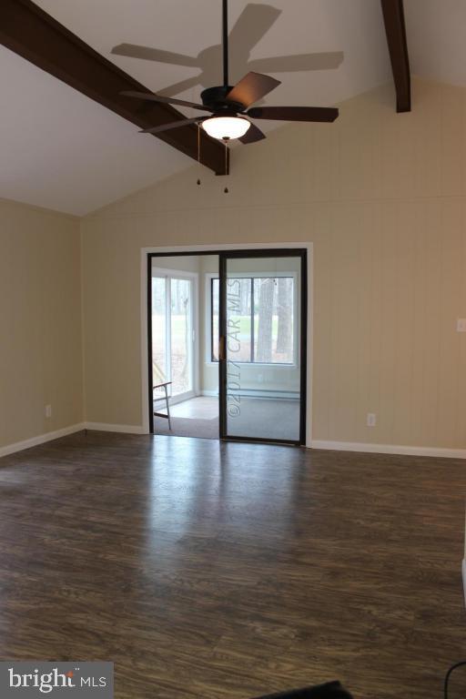 129 Windjammer Road Ocean Pines, MD 21811 - Photo 7 of 36 a view of an empty room with window and wooden floor