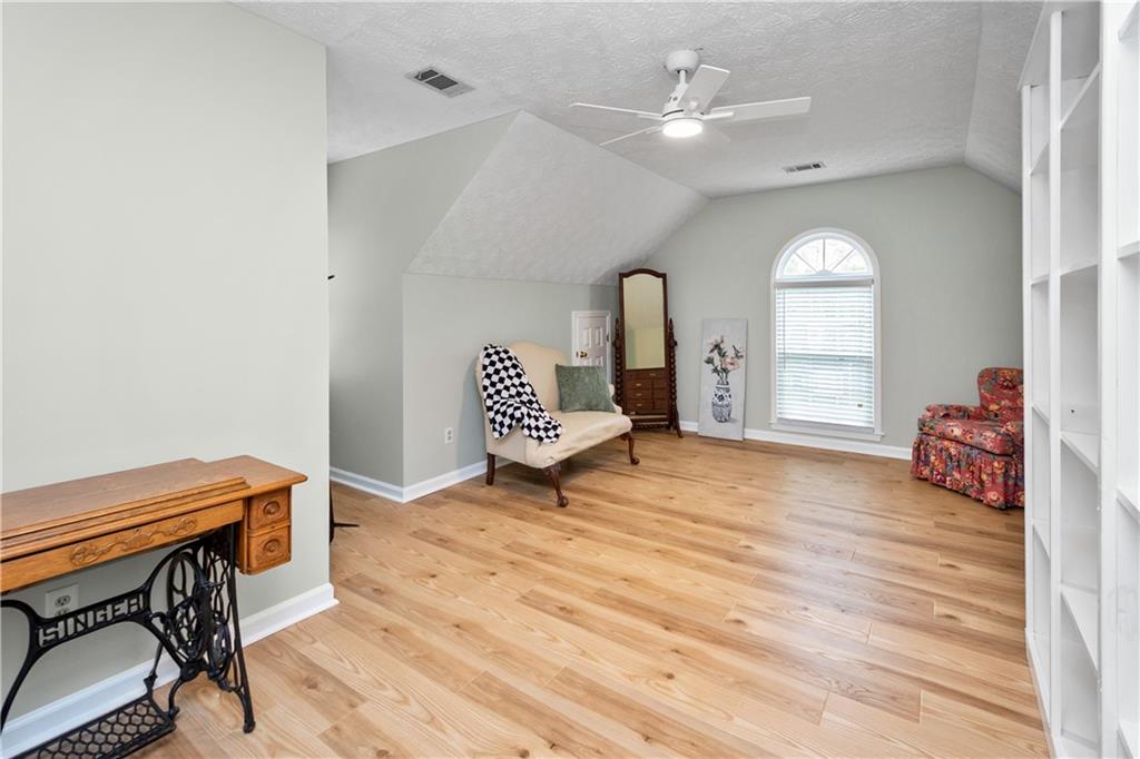 405 Ridgemont Drive Fayetteville, GA 30215 - Photo 25 of 43 a living room with furniture and a wooden floor