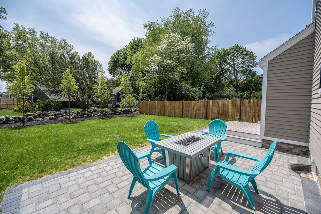 61 Sheffield Road Melrose, MA 02176 - Photo 17 of 21 a view of a chair and table in backyard of the house