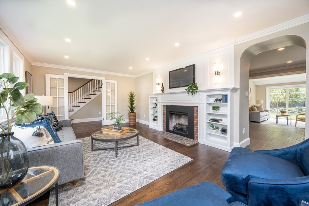 61 Sheffield Road Melrose, MA 02176 - Photo 4 of 21 a living room with furniture and a fireplace