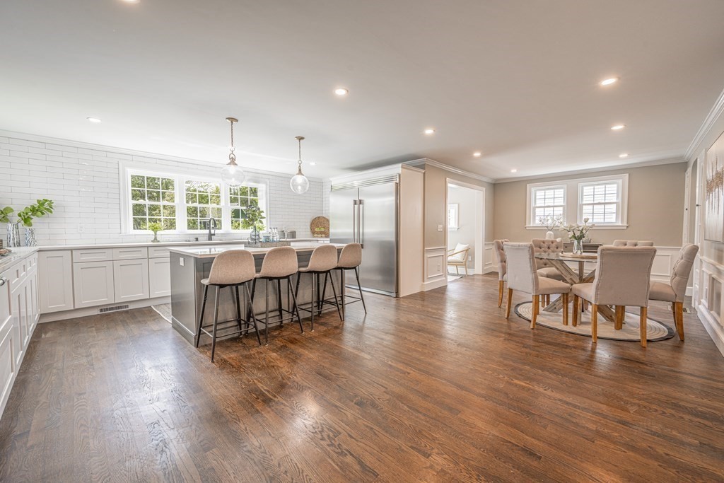 61 Sheffield Road Melrose, MA 02176 - Photo 6 of 21 an open kitchen with a table and chairs in it