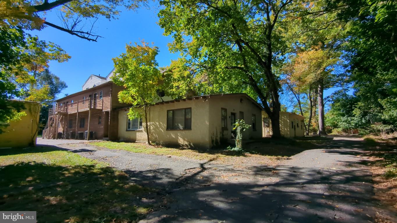 900 Main Street Brookhaven, PA 19015 - Photo 12 of 42 a brick house with trees in front of it