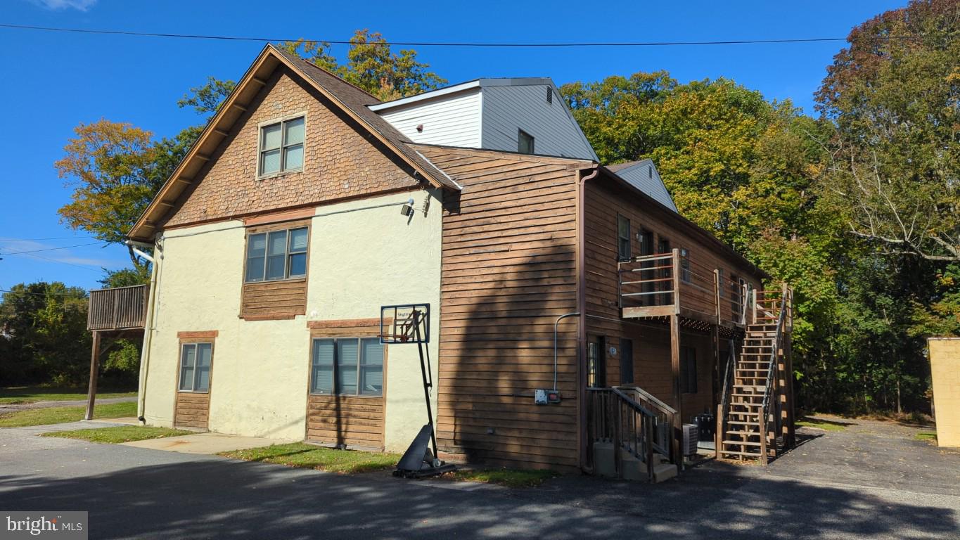 900 Main Street Brookhaven, PA 19015 - Photo 25 of 42 a view of a house with a yard