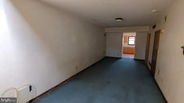 a view of a hallway with a window