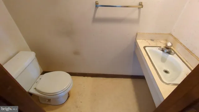 a bathroom with a toilet and a sink