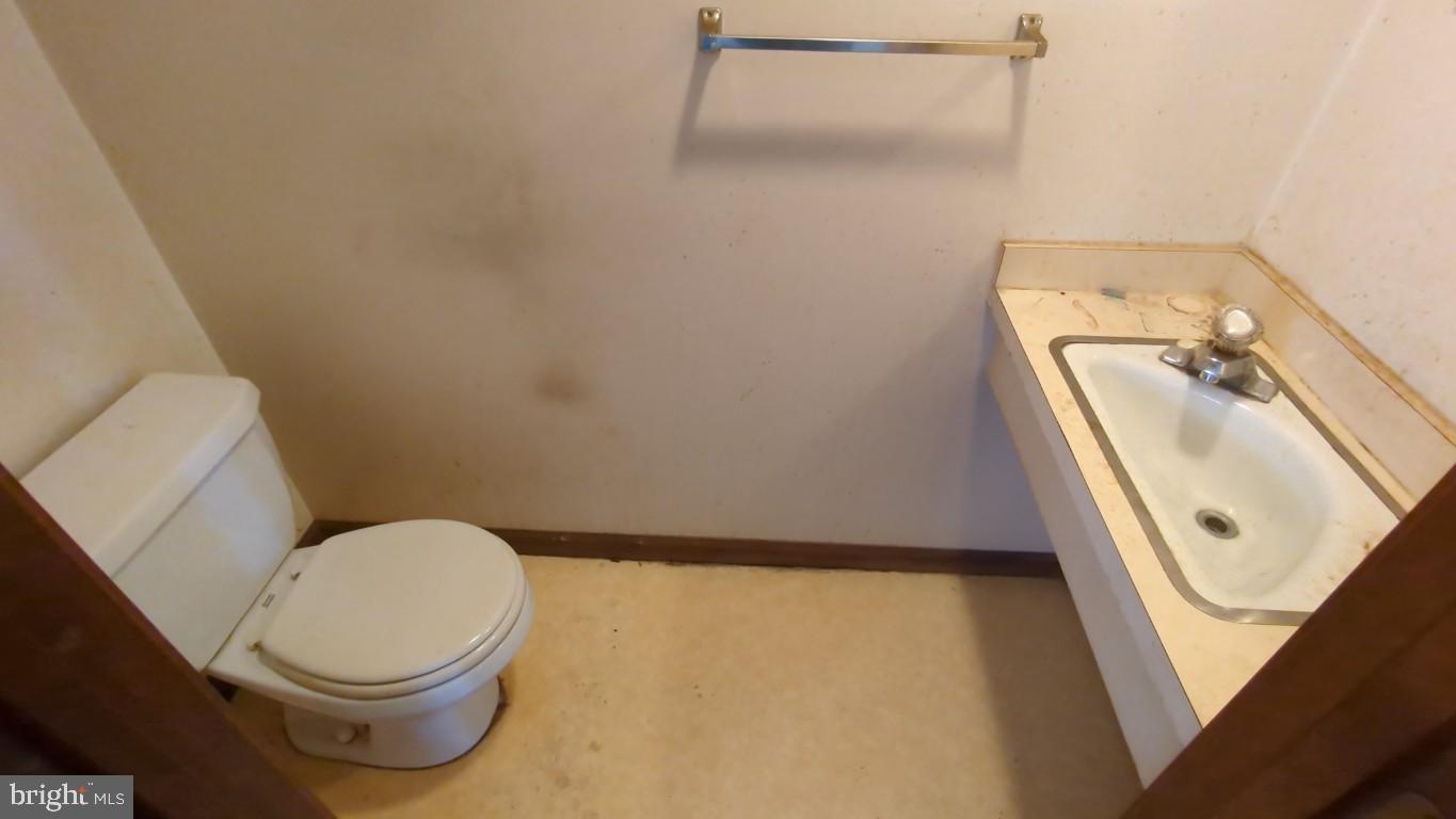 900 Main Street Brookhaven, PA 19015 - Photo 30 of 42 a bathroom with a toilet and a sink