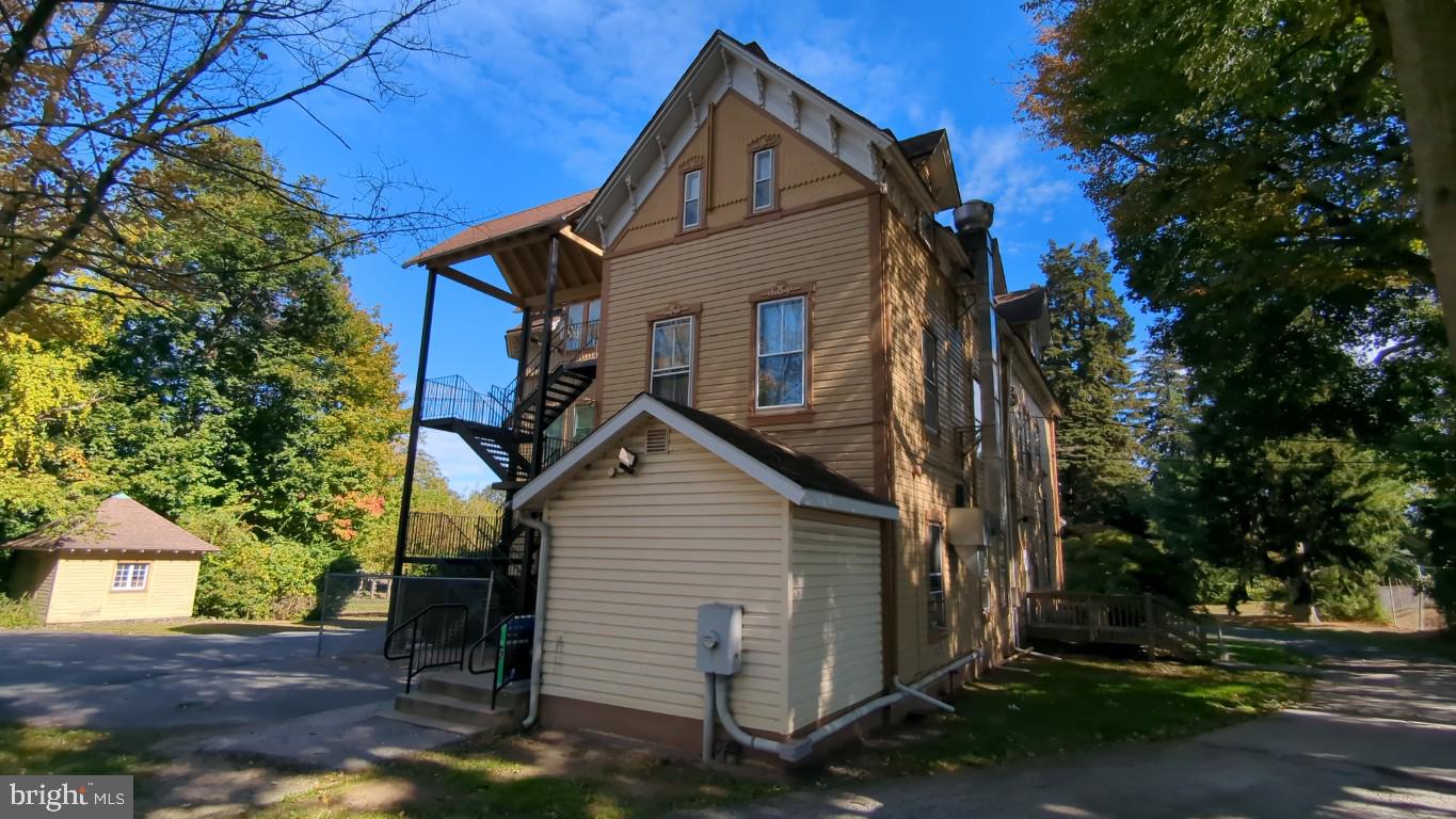 900 Main Street Brookhaven, PA 19015 - Photo 3 of 42 a view of a house with a yard