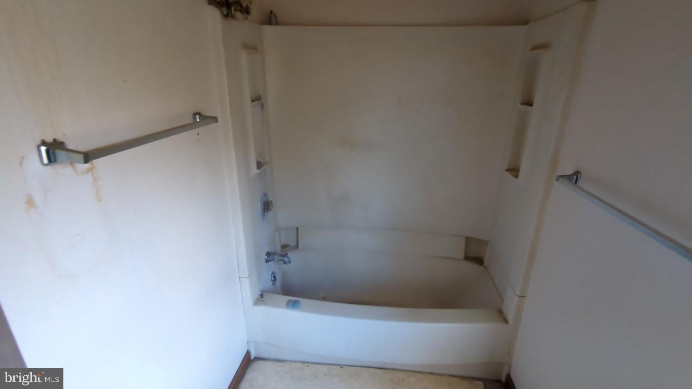 900 Main Street Brookhaven, PA 19015 - Photo 34 of 42 a bathroom with a bathtub