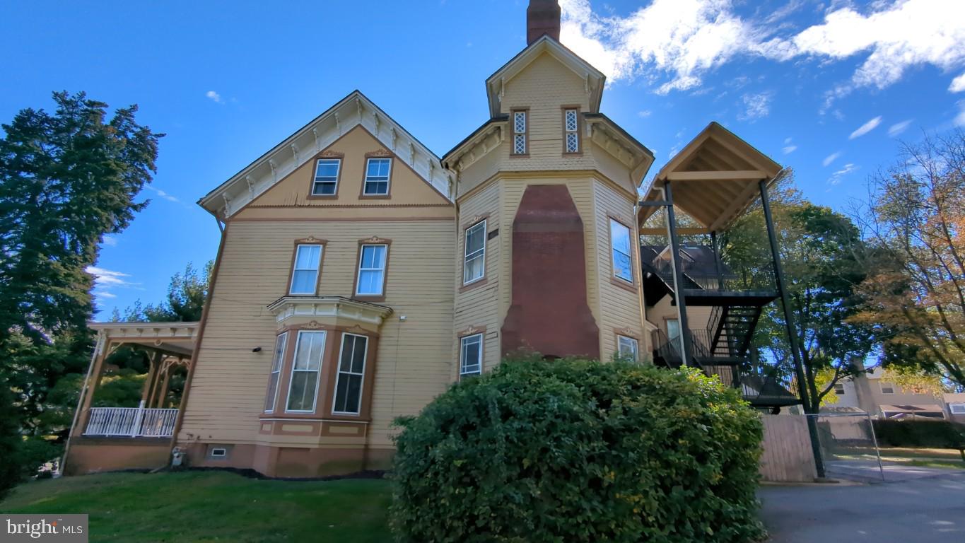 900 Main Street Brookhaven, PA 19015 - Photo 5 of 42 a front view of a house with a yard