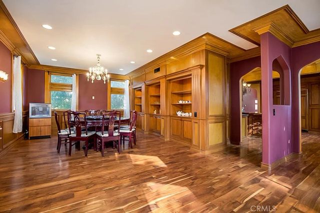 a view of a dining hall with many windows