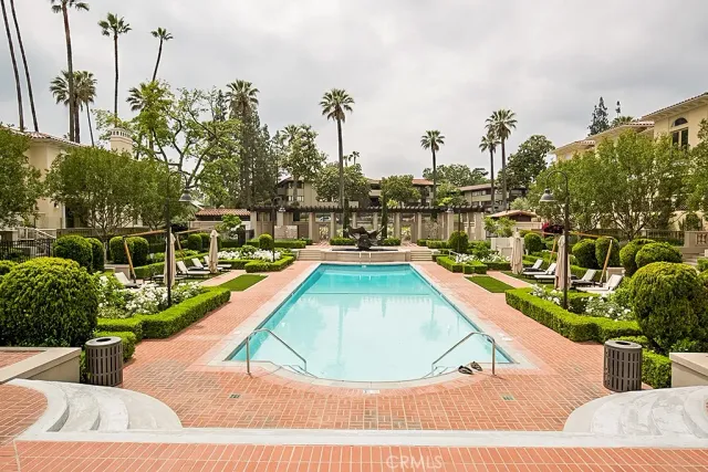 a view of swimming pool from a balcony