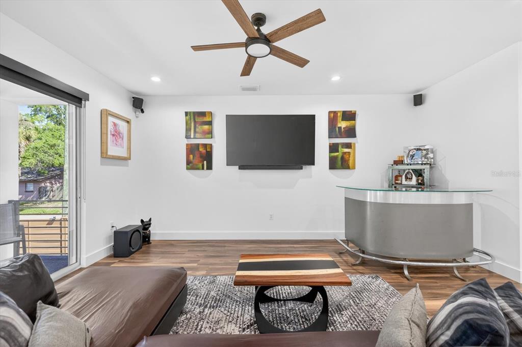 7301 South Elliott Street Tampa, FL 33616 - Photo 11 of 54 a living room with furniture and a flat screen tv