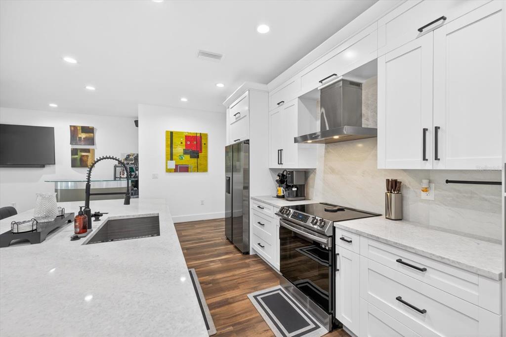 7301 South Elliott Street Tampa, FL 33616 - Photo 17 of 54 a kitchen with cabinets and stainless steel appliances