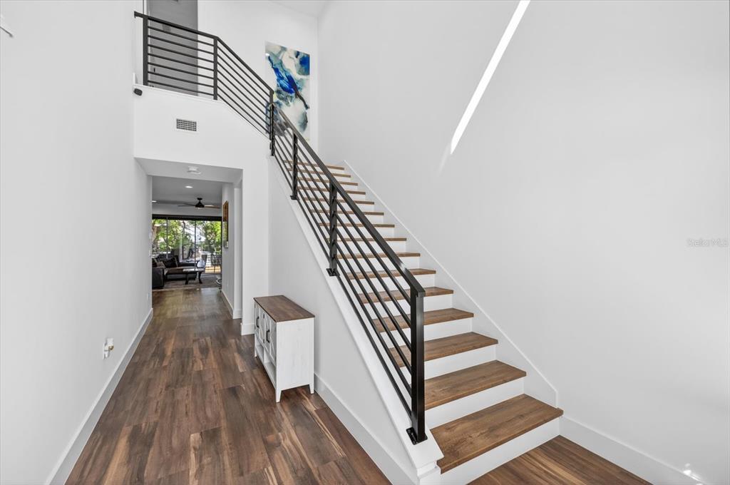 7301 South Elliott Street Tampa, FL 33616 - Photo 4 of 54 a view of entryway and hall with wooden floor