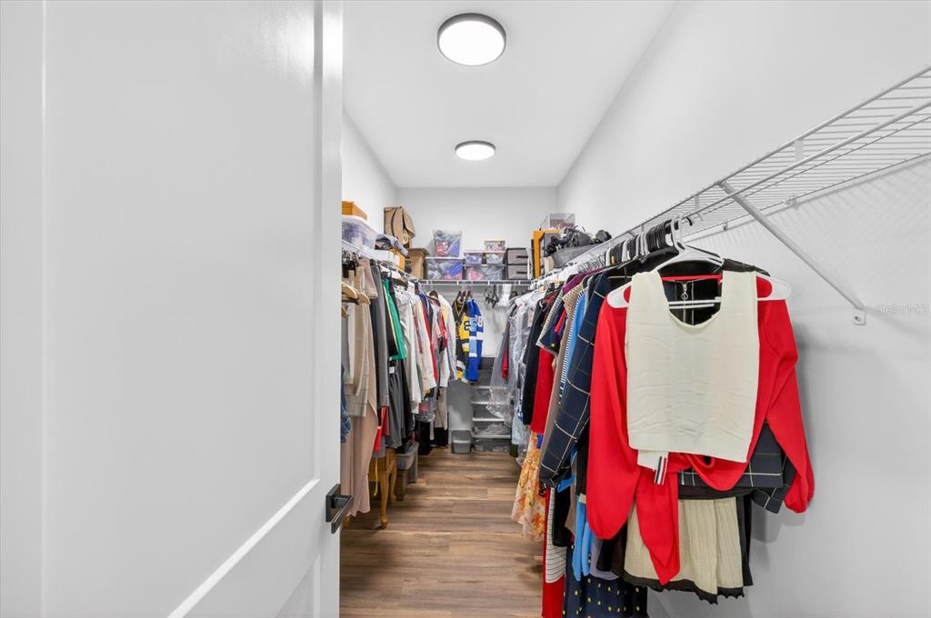 7301 South Elliott Street Tampa, FL 33616 - Photo 42 of 54 a view of walk in closet with clothes and shoes